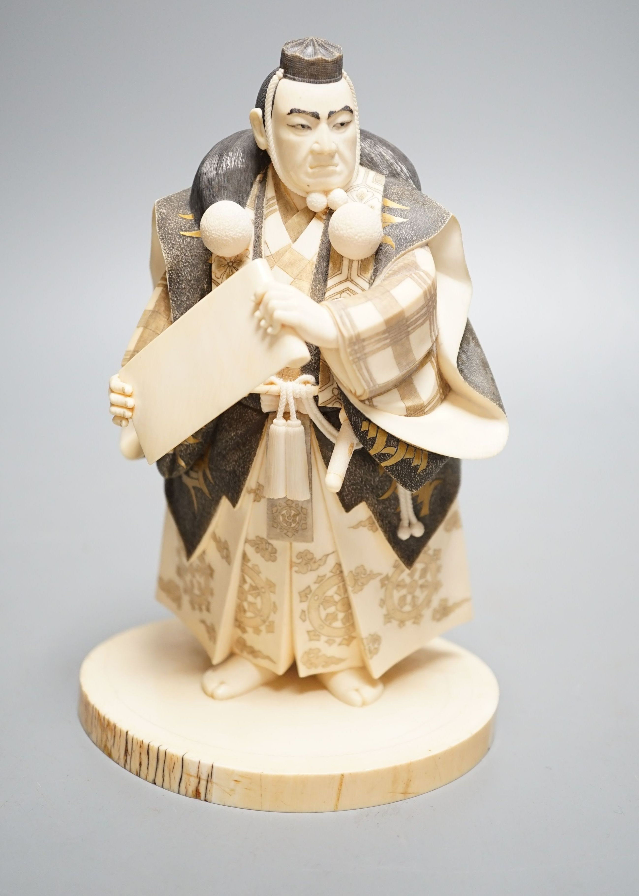 A Japanese ivory figure of a Yamabushi warrior monk, Taisho/early Showa period, signed to a lacquer tablet - 18.5cm tall